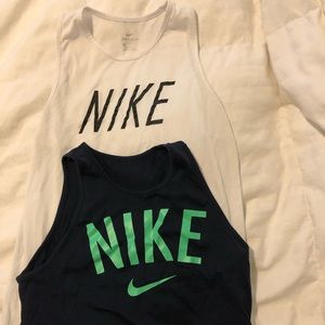 Two women’s nike workout shirts